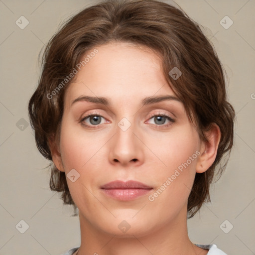 Joyful white young-adult female with medium  brown hair and green eyes