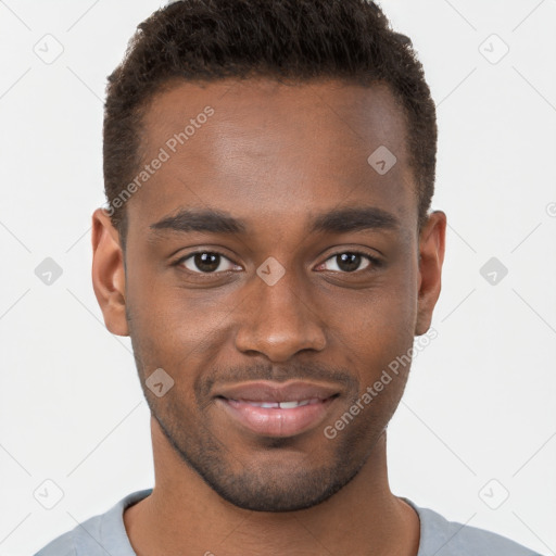 Joyful black young-adult male with short  brown hair and brown eyes