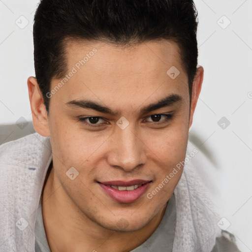 Joyful latino young-adult male with short  brown hair and brown eyes