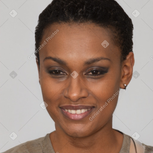 Joyful black young-adult female with short  brown hair and brown eyes