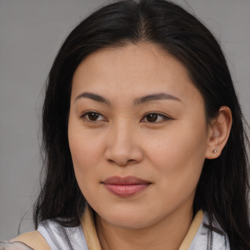 Joyful asian young-adult female with long  brown hair and brown eyes