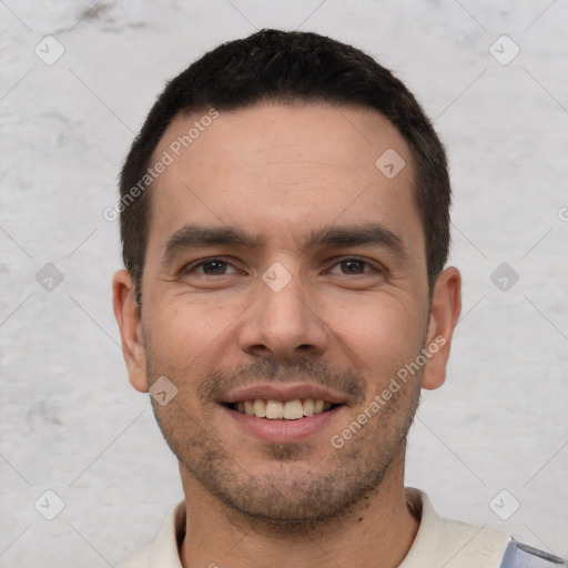 Joyful white young-adult male with short  black hair and brown eyes