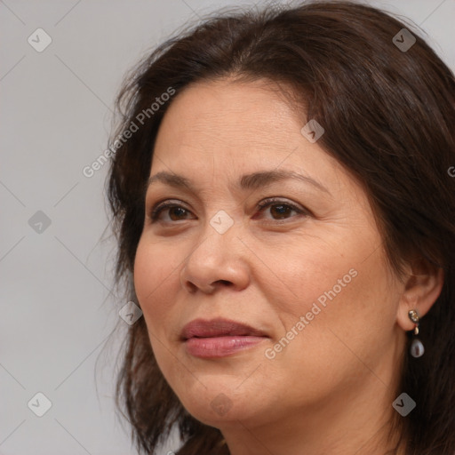 Joyful white adult female with medium  brown hair and brown eyes