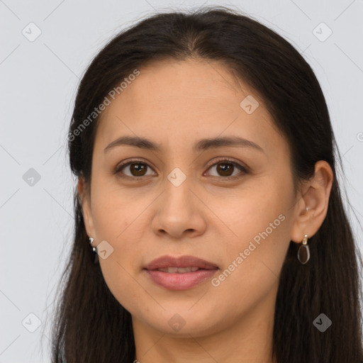 Joyful latino young-adult female with long  brown hair and brown eyes