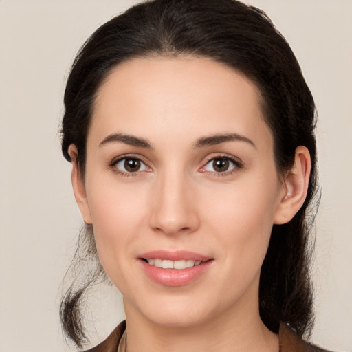 Joyful white young-adult female with long  brown hair and brown eyes