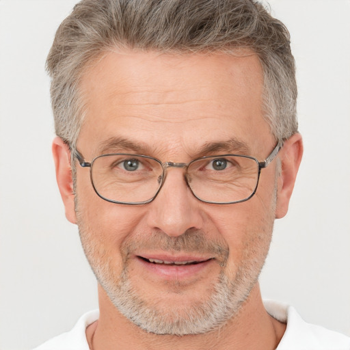 Joyful white middle-aged male with short  gray hair and brown eyes