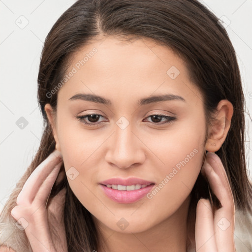 Joyful white young-adult female with long  brown hair and brown eyes