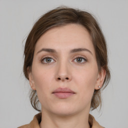 Neutral white young-adult female with medium  brown hair and brown eyes