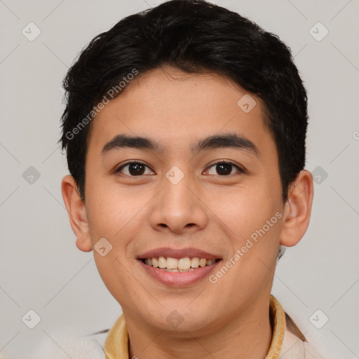 Joyful asian young-adult male with short  brown hair and brown eyes