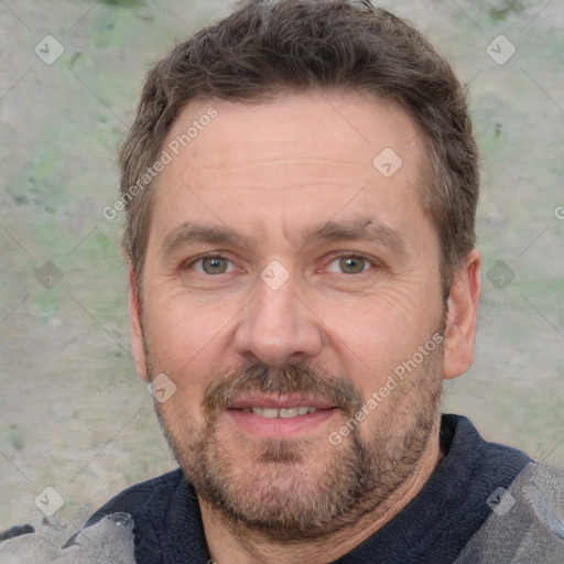 Joyful white adult male with short  brown hair and grey eyes