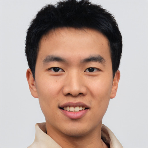 Joyful asian young-adult male with short  black hair and brown eyes