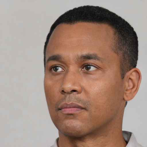 Neutral black young-adult male with short  black hair and brown eyes