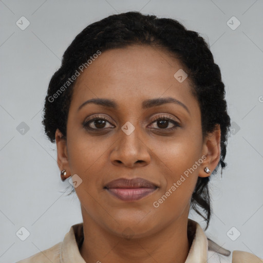 Joyful black young-adult female with short  black hair and brown eyes