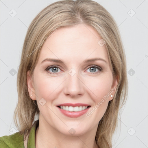 Joyful white young-adult female with medium  brown hair and green eyes