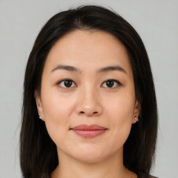 Joyful asian young-adult female with medium  brown hair and brown eyes