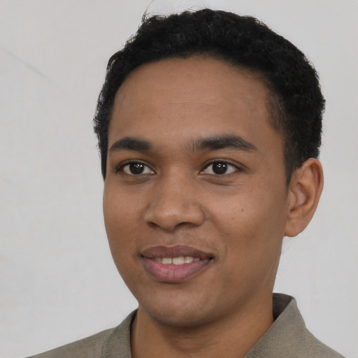 Joyful latino young-adult male with short  black hair and brown eyes