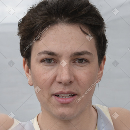 Joyful white adult female with short  brown hair and brown eyes