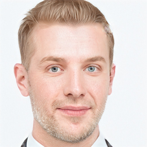 Joyful white adult male with short  brown hair and blue eyes