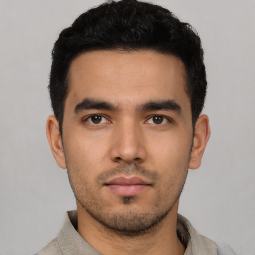 Neutral latino young-adult male with short  black hair and brown eyes