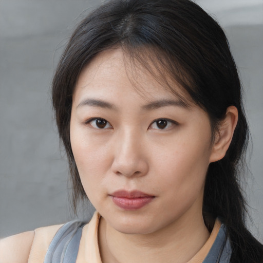 Neutral asian young-adult female with medium  brown hair and brown eyes