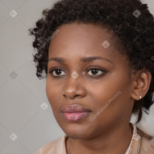 Neutral black young-adult female with medium  brown hair and brown eyes