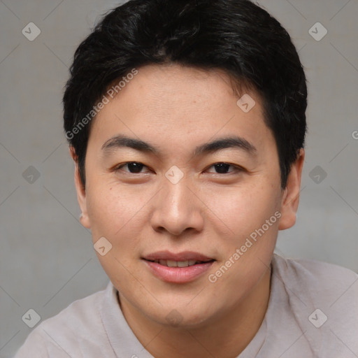 Joyful asian young-adult male with short  brown hair and brown eyes