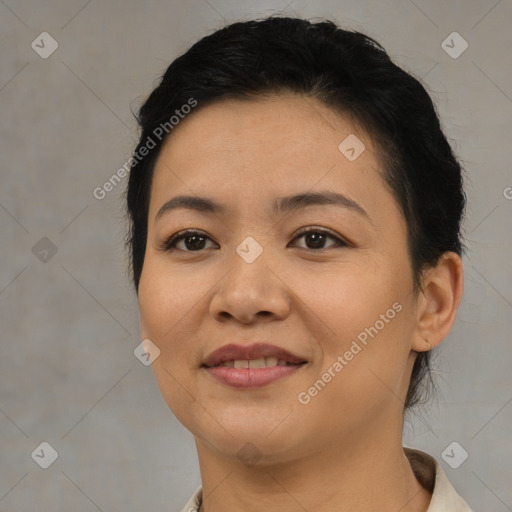 Joyful asian young-adult female with short  brown hair and brown eyes