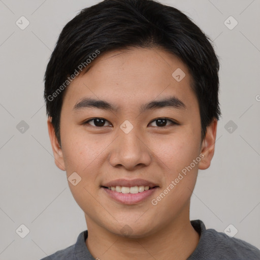 Joyful asian young-adult male with short  black hair and brown eyes