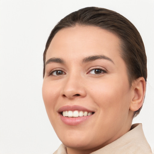 Joyful white young-adult female with short  brown hair and brown eyes