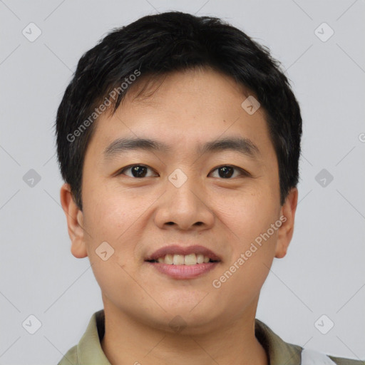 Joyful asian young-adult male with short  brown hair and brown eyes