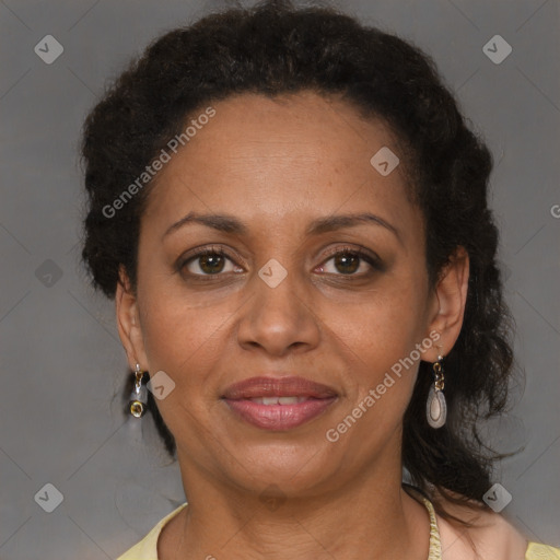 Joyful black adult female with medium  brown hair and brown eyes