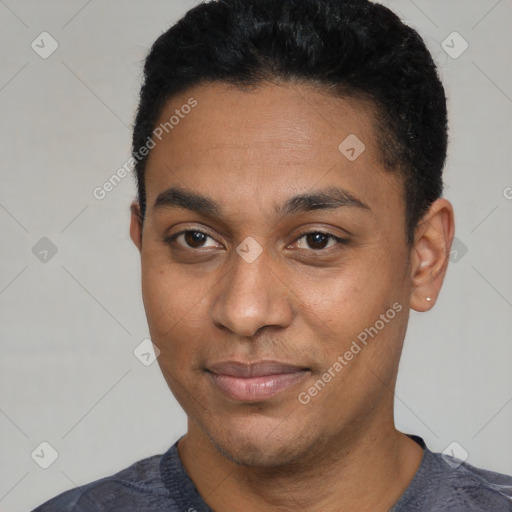 Joyful black young-adult male with short  black hair and brown eyes