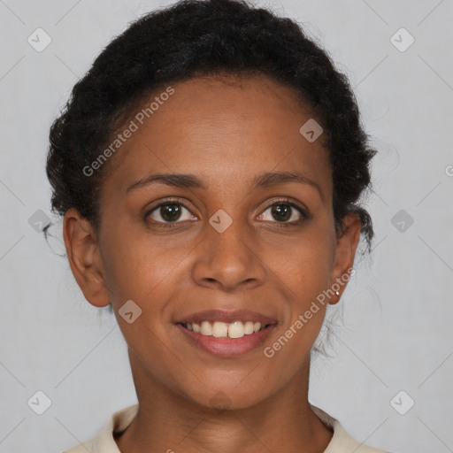 Joyful black young-adult female with short  brown hair and brown eyes