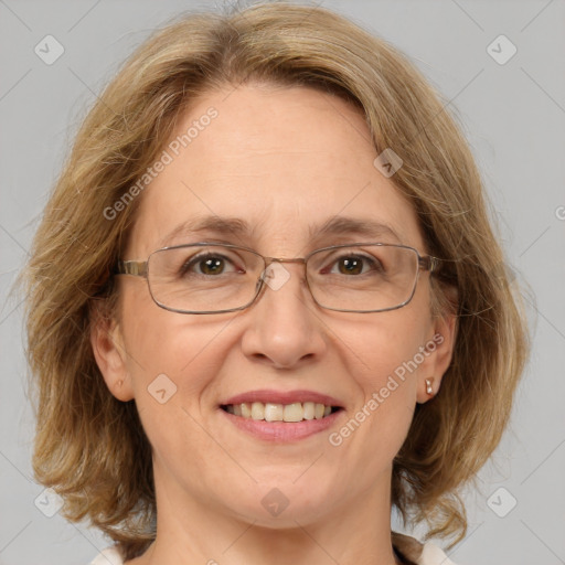 Joyful white adult female with medium  brown hair and green eyes