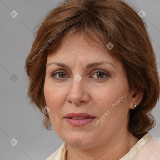 Joyful white adult female with medium  brown hair and brown eyes