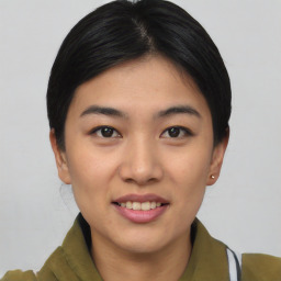 Joyful asian young-adult female with short  brown hair and brown eyes