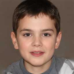 Joyful white child male with short  brown hair and brown eyes