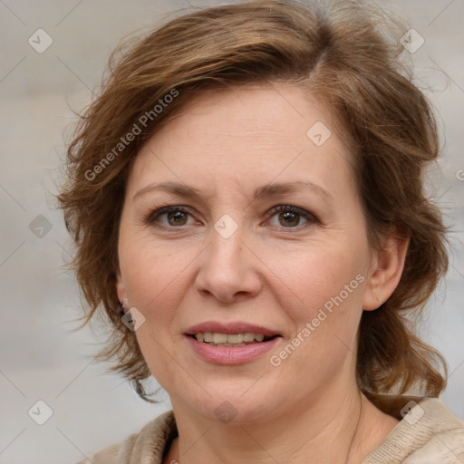 Joyful white adult female with medium  brown hair and blue eyes