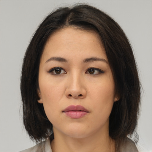 Neutral asian young-adult female with medium  brown hair and brown eyes