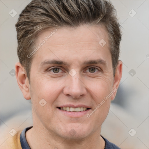 Joyful white adult male with short  brown hair and grey eyes