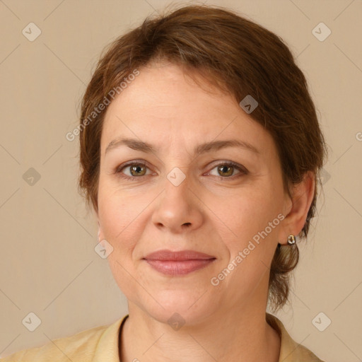 Joyful white adult female with medium  brown hair and green eyes