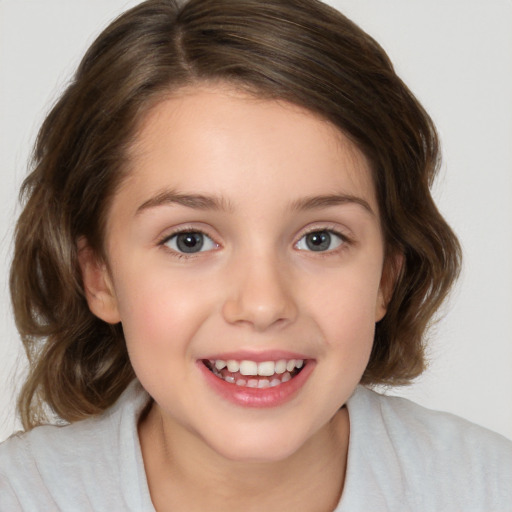 Joyful white child female with medium  brown hair and brown eyes