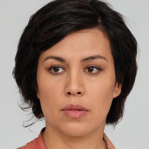 Neutral asian young-adult female with medium  brown hair and brown eyes