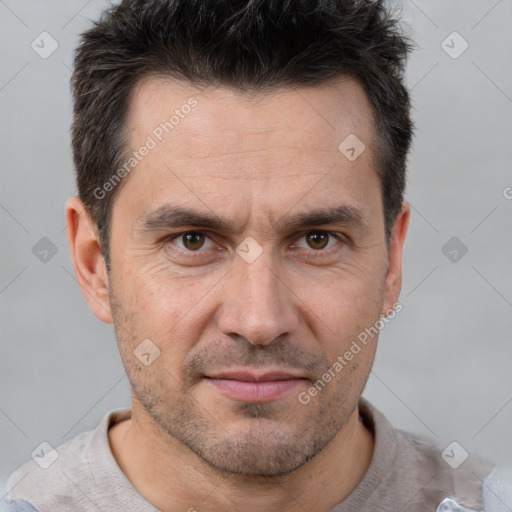 Joyful white adult male with short  brown hair and brown eyes