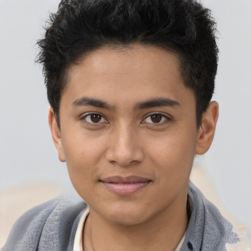 Joyful latino young-adult male with short  brown hair and brown eyes