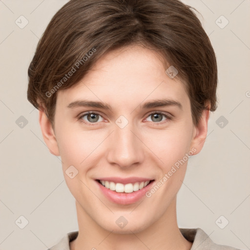 Joyful white young-adult female with short  brown hair and grey eyes