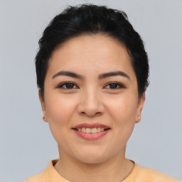 Joyful asian young-adult female with short  black hair and brown eyes