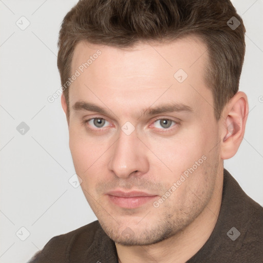 Neutral white young-adult male with short  brown hair and grey eyes