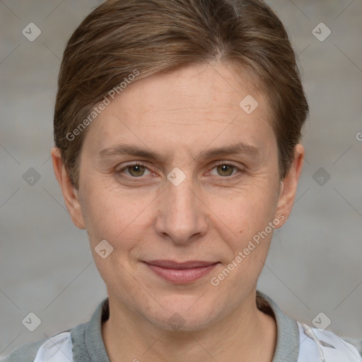 Joyful white adult female with short  brown hair and grey eyes