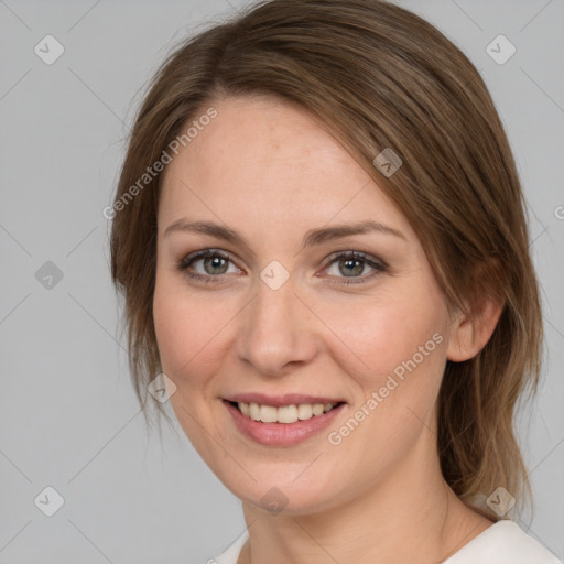 Joyful white young-adult female with medium  brown hair and green eyes